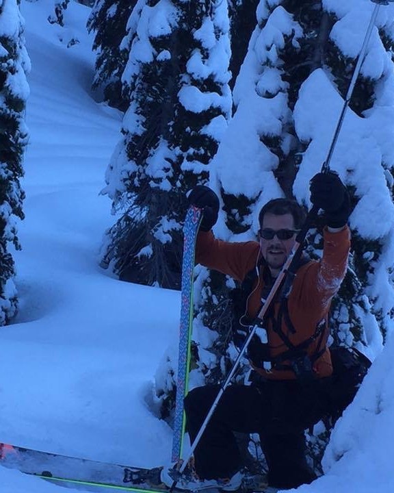 Backcountry skier moving through deep snow