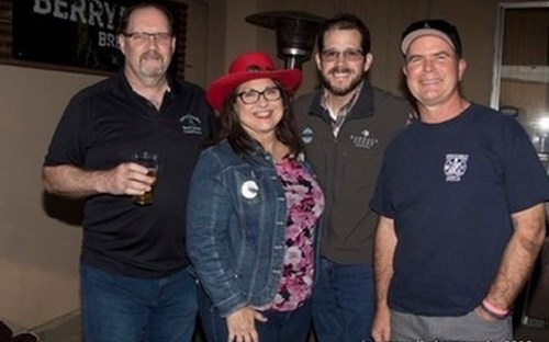 Four people standing together at Berryessa Brewing during a 2018 regional event