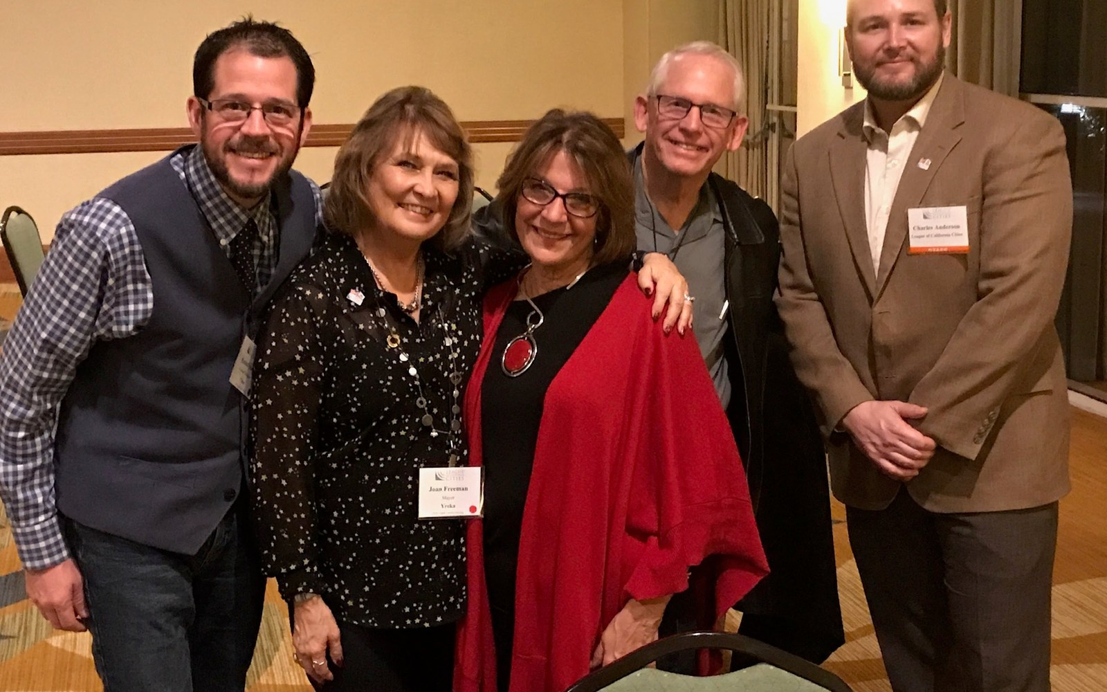Five people standing together at a League of California Cities gathering