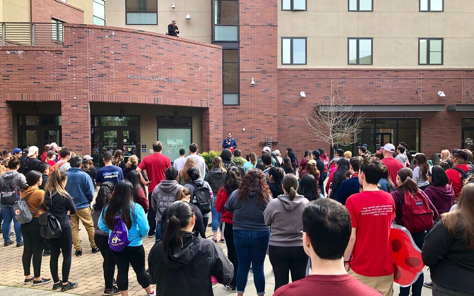 Large public gathering outside a Chico State residential dining center