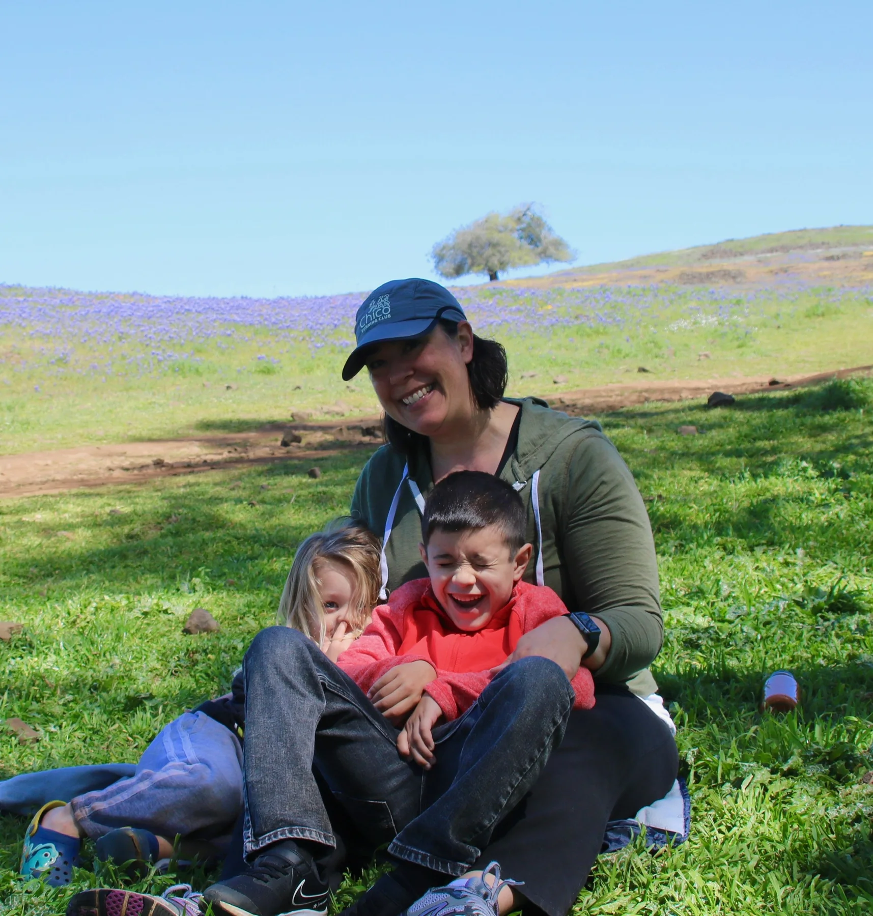 Stone family outdoor picnic in a green meadow