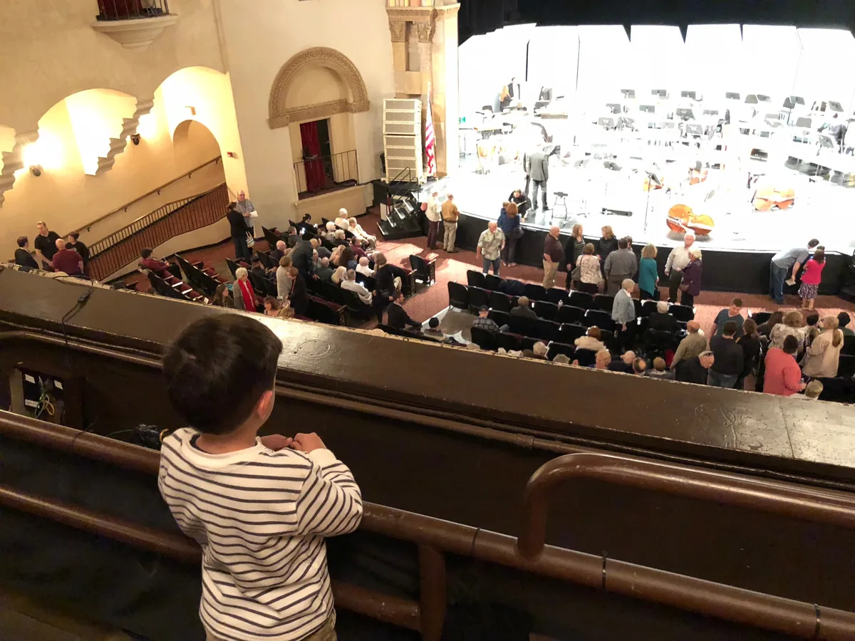 Rhys Stone watching the North State Symphony from the balcony