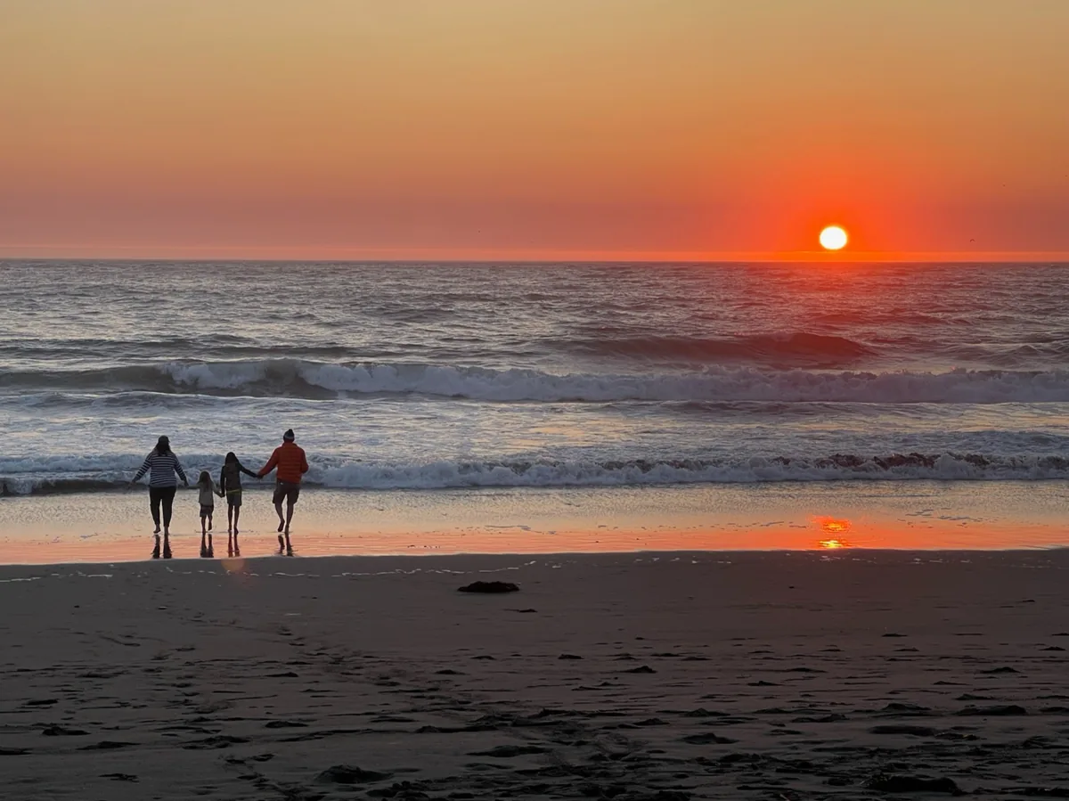 Stone family at sunset on the Pacific coast near Westport, California