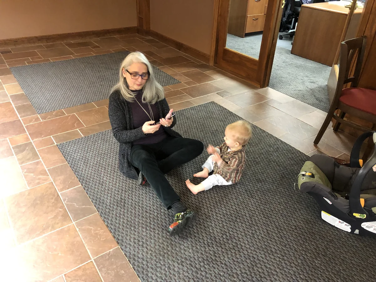 Karden on the floor of the Golden Valley Bank lobby while Safe Space Chico treasury money is prepared for deposit