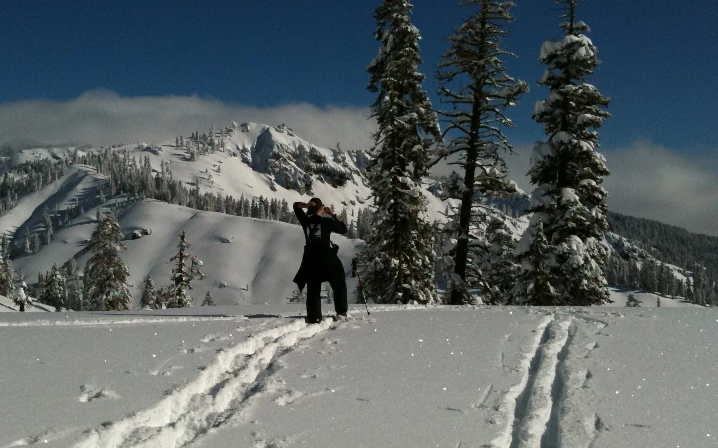 Krista Stone in Lassen Volcanic National Park on the clear morning after snow camping through a storm