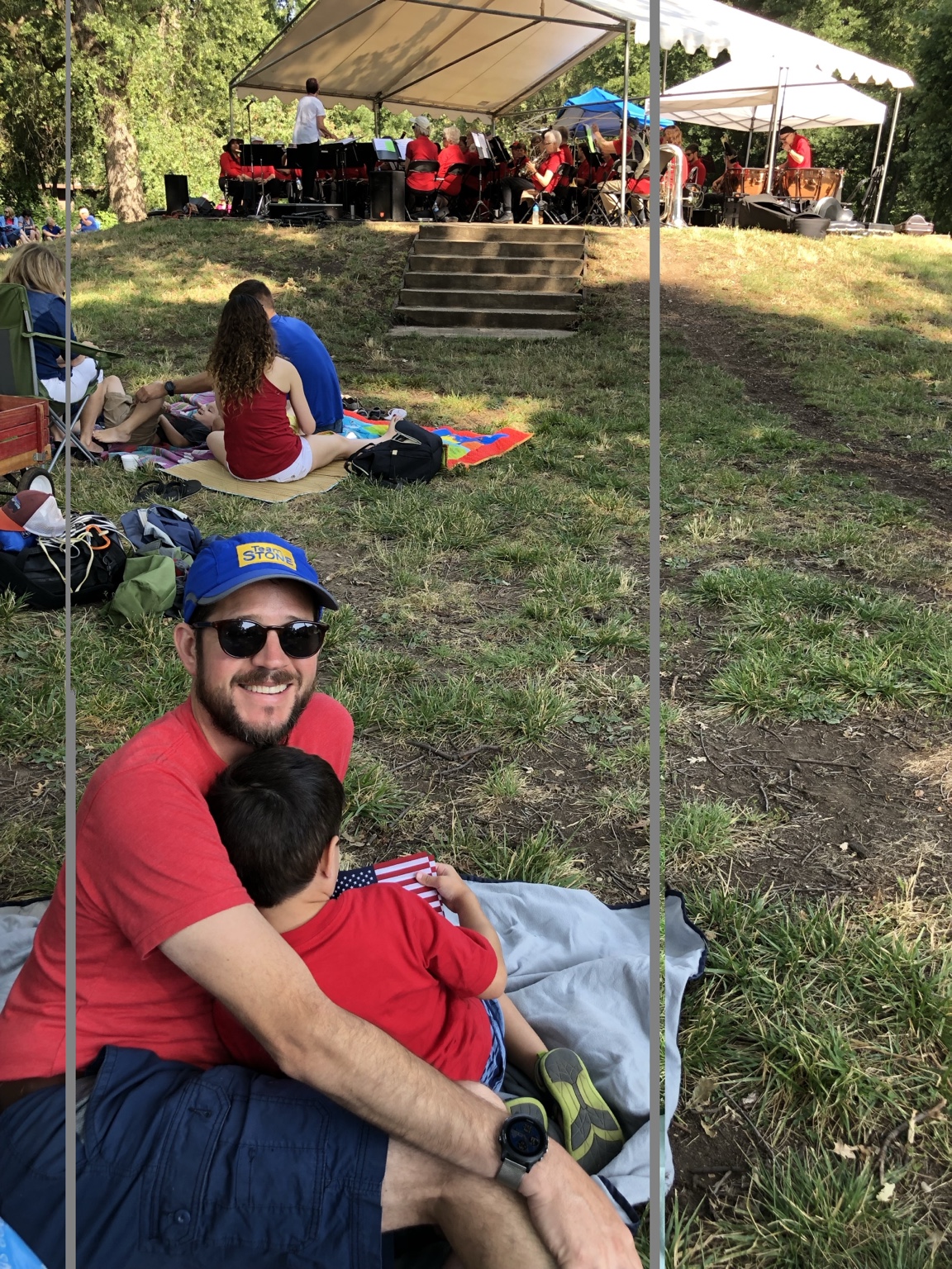 Randall Stone and Rhys Stone at the Chico Running Club Fourth of July race while the Chico Community Band performs