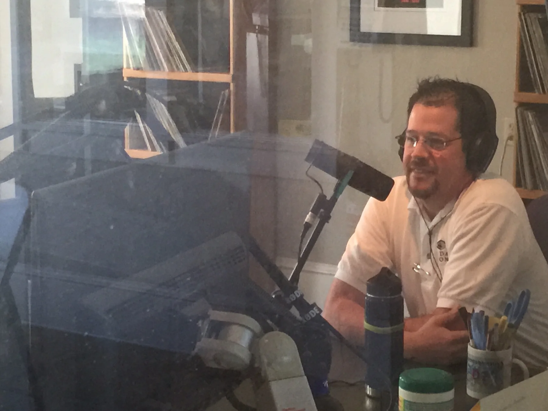 Randall Stone seated at a studio microphone inside KZFR in downtown Chico