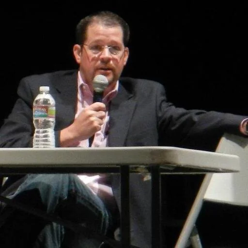 Randall Stone speaking as a panelist at a public forum