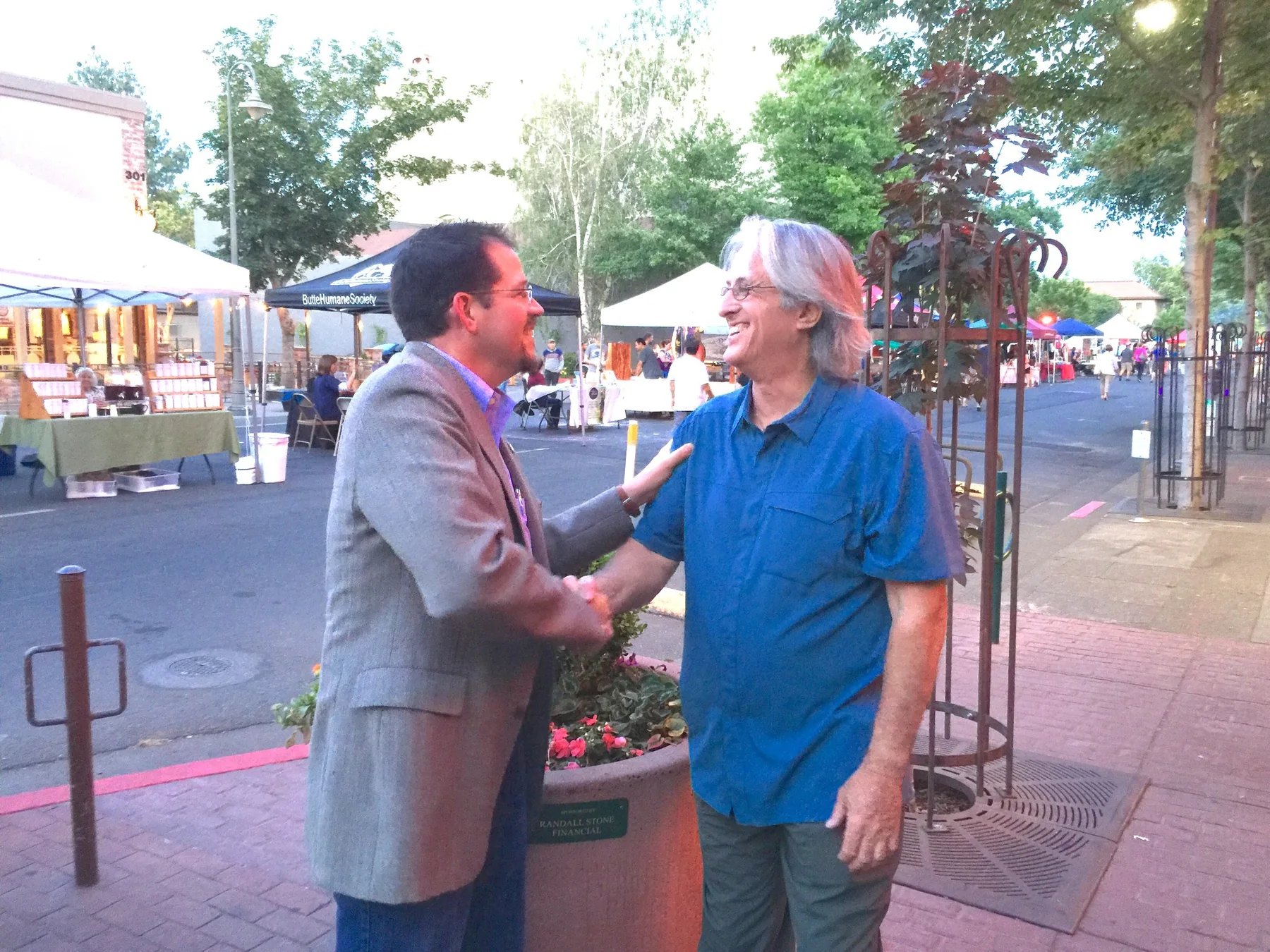 Randall Stone greeting former Chico City Councilmember and retired CHP officer Tom Nickell in downtown Chico