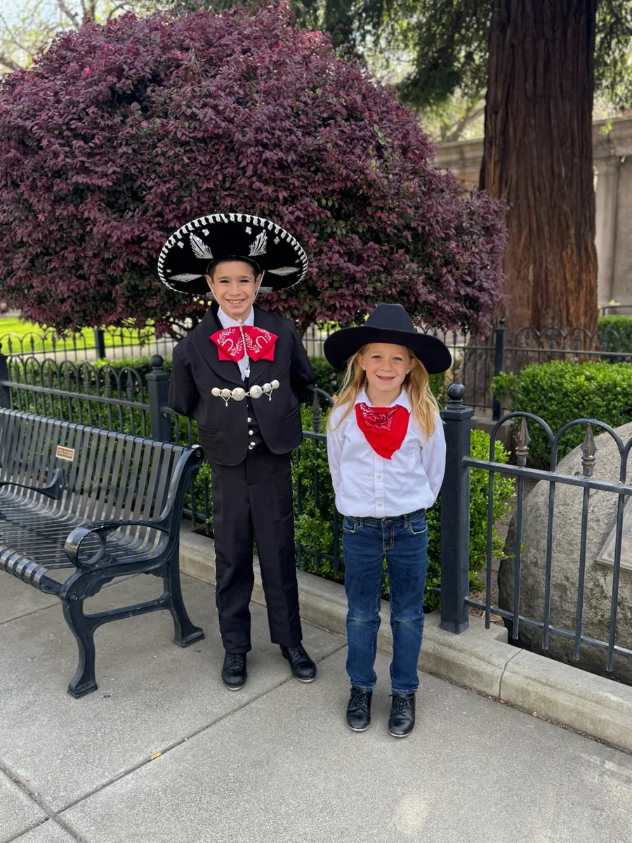 Rhys and Karden Stone dressed for a Rosas de María Parade of Lights performance