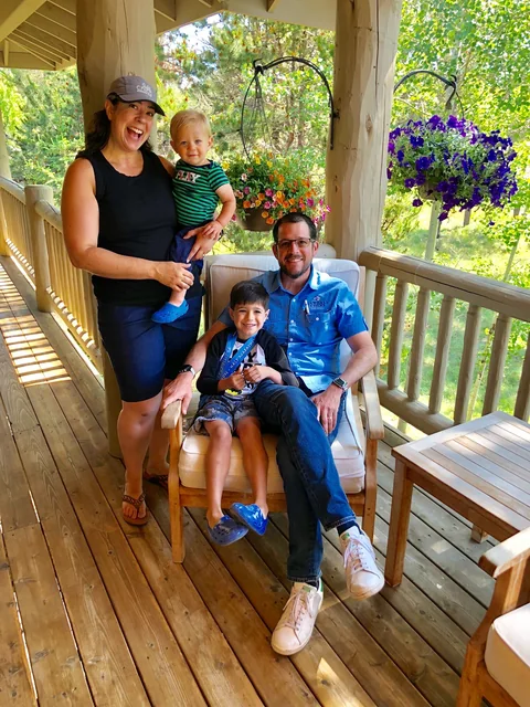 Stone family gathered together on a porch during an outdoor trip