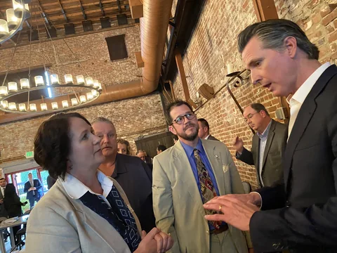 Randall Stone with Gavin Newsom and Melanie Bagby at a regional public-service gathering in 2020