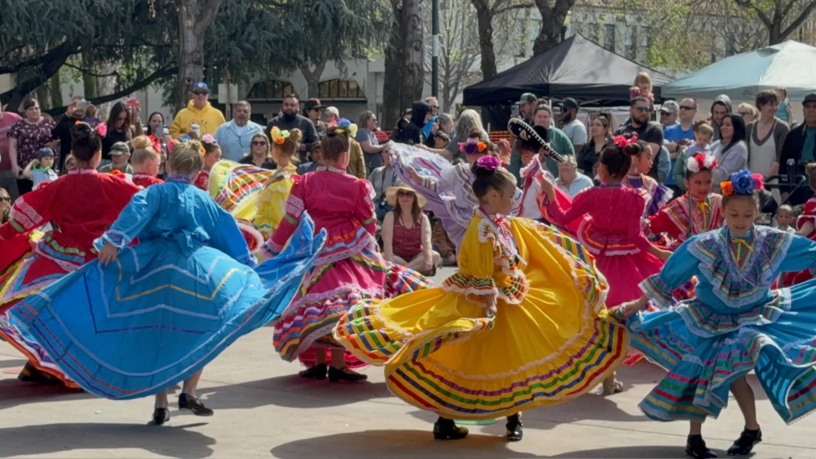 Rosas de María dancers performing in colorful folklórico dresses