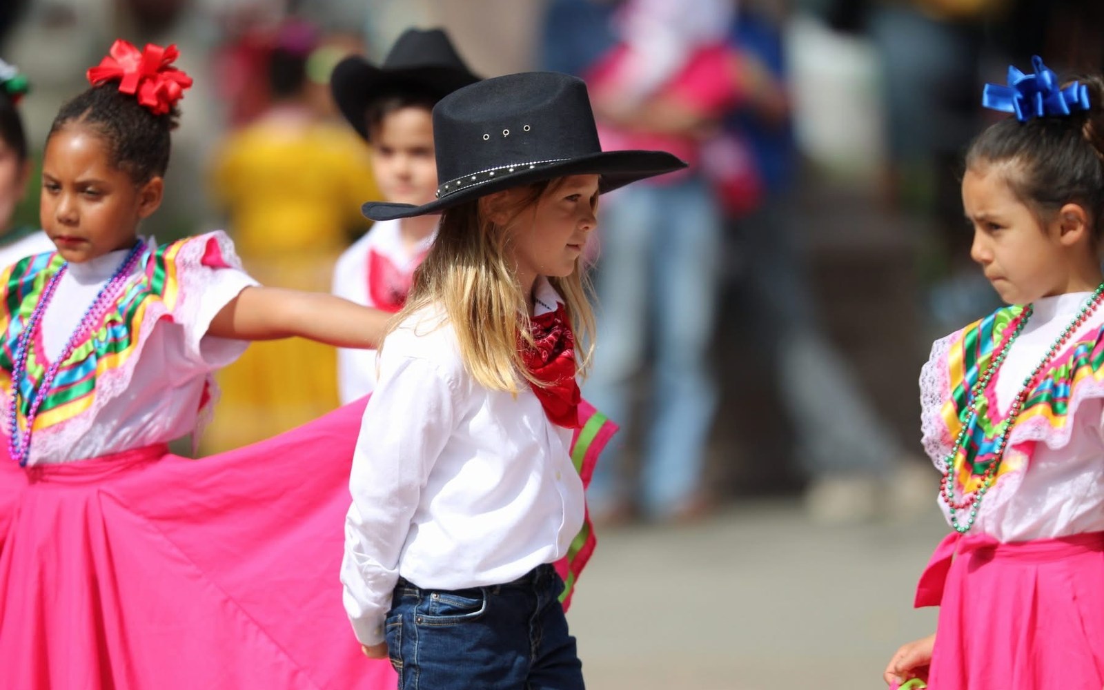 Young Ballet Folklórico performers at a community event
